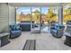Relaxing screened-in patio with cozy seating and view of outdoor living space, including a jacuzzi at 980 Desert Wheatgrass Dr., Myrtle Beach, SC 29579