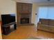 Living room with a brick fireplace and hardwood floors at 1025 Carolina Rd. # Ee-3, Conway, SC 29526