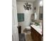 Clean bathroom with a toilet, vanity, and wall-mounted shelving at 106 Fonza St., Conway, SC 29526