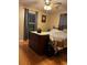 Bright bedroom with hardwood floors and a dresser next to the bed at 106 Fonza St., Conway, SC 29526