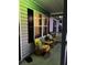 Relaxing front porch with yellow chairs and potted plants at 106 Fonza St., Conway, SC 29526