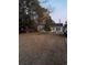 Spacious front yard with mature trees and American flag at 106 Fonza St., Conway, SC 29526
