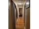 Long hallway with hardwood floors and access to other rooms at 106 Fonza St., Conway, SC 29526
