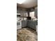 Kitchen with gray cabinets, tile floor, and ample counter space at 106 Fonza St., Conway, SC 29526