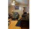 Cozy living room featuring hardwood floors, comfortable seating, and a ceiling fan at 106 Fonza St., Conway, SC 29526