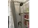 Close-up of shower with shelf and shower head at 106 Fonza St., Conway, SC 29526