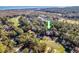 Aerial view of a community showcasing lush landscaping, golf course, and waterfront scenery at 14 Stillwood Dr. # 2, Pawleys Island, SC 29585