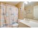 Bright bathroom featuring a sink with vanity and coastal-themed shower curtain at 14 Stillwood Dr. # 2, Pawleys Island, SC 29585