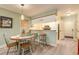 Charming dining area next to kitchen with seating for four and a decorative buffet at 14 Stillwood Dr. # 2, Pawleys Island, SC 29585