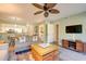 A cozy living room with adjacent kitchen and comfortable seating at 14 Stillwood Dr. # 2, Pawleys Island, SC 29585