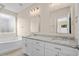 Double vanity bathroom with granite countertop, soaking tub, and shower at 143 Crane Dr. # A, Pawleys Island, SC 29585