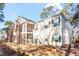 Exterior view of two-story townhome with screened porch at 143 Crane Dr. # A, Pawleys Island, SC 29585