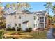 Light yellow multi-unit building with landscaping and walkway at 143 Crane Dr. # A, Pawleys Island, SC 29585