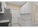 White shaker cabinets and granite countertops in this kitchen at 143 Crane Dr. # A, Pawleys Island, SC 29585