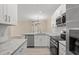 Spacious kitchen with island, granite counters & stainless steel appliances at 143 Crane Dr. # A, Pawleys Island, SC 29585
