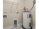 Laundry room with shelving and water heater at 143 Crane Dr. # A, Pawleys Island, SC 29585