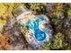 Inviting community pool with lounge chairs and a unique shape at 143 Crane Dr. # A, Pawleys Island, SC 29585