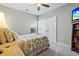 Bedroom with double doors and leafy bedding at 144 Shenandoah Dr., Murrells Inlet, SC 29576