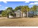 Brick home with palm trees and landscaped yard at 144 Shenandoah Dr., Murrells Inlet, SC 29576