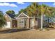 Brick home with palm trees and well-manicured lawn at 144 Shenandoah Dr., Murrells Inlet, SC 29576