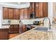 Modern kitchen with granite countertops and stainless steel appliances at 144 Shenandoah Dr., Murrells Inlet, SC 29576