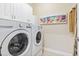 Laundry room with washer, dryer, and cabinets at 144 Shenandoah Dr., Murrells Inlet, SC 29576