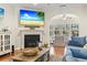 Living room with fireplace and access to sunroom at 144 Shenandoah Dr., Murrells Inlet, SC 29576