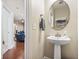 Small powder room with pedestal sink and mirror at 144 Shenandoah Dr., Murrells Inlet, SC 29576