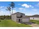 Two-story house with gray siding, white garage door, and green lawn at 161 Saddle St, Conway, SC 29527