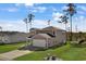 Two-story house with gray siding, attached garage, and a grassy yard at 161 Saddle St, Conway, SC 29527