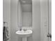 Clean and modern bathroom with pedestal sink and large mirror at 161 Saddle St, Conway, SC 29527