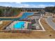 Aerial view of community pool with surrounding homes and landscaping at 161 Saddle St, Conway, SC 29527