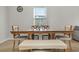 Dining area with wooden table and bench seating for four at 161 Saddle St, Conway, SC 29527