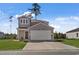 Two-story house with gray siding, white garage door, and a well-maintained lawn at 161 Saddle St, Conway, SC 29527
