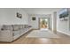 Bright Gathering room with hardwood floors, sectional sofa, and access to a patio at 161 Saddle St, Conway, SC 29527