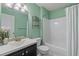 Bathroom with green walls features a shower and sink at 1900 Duffy St. # C-7, North Myrtle Beach, SC 29582