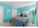 Vibrant bedroom with colorful bedding, closet, and a decorative mirror creates a cheerful space at 1900 Duffy St. # C-7, North Myrtle Beach, SC 29582
