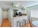 Well-lit kitchen with a bar and stainless steel appliances at 1900 Duffy St. # C-7, North Myrtle Beach, SC 29582
