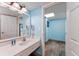 Bathroom vanity with a large mirror, hairdryer, sink, and plenty of space, with a peek into the next room at 201 74Th Ave. N # 2640, Myrtle Beach, SC 29572