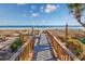 Inviting beach access boardwalk offering a seamless transition to the pristine sandy beach at 201 74Th Ave. N # 2640, Myrtle Beach, SC 29572