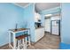 Cozy kitchenette area with wooden floors, small dining table, and efficient appliances and plenty of storage at 201 74Th Ave. N # 2640, Myrtle Beach, SC 29572