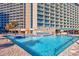Spacious pool deck with lounge chairs and ocean view at 201 74Th Ave. N # 2640, Myrtle Beach, SC 29572