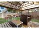 Relaxing backyard gazebo with hot tub, patio furniture, and bar at 214 13Th Ave. S # C, Surfside Beach, SC 29575