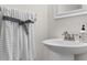 Small bathroom with pedestal sink and decorative towel at 214 13Th Ave. S # C, Surfside Beach, SC 29575
