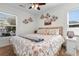 King-size bed in a coastal-themed bedroom with two windows at 214 13Th Ave. S # C, Surfside Beach, SC 29575