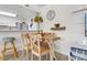 Bright dining area with a wooden table and chairs, perfect for small gatherings at 214 13Th Ave. S # C, Surfside Beach, SC 29575