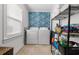 Laundry room with washer, dryer, and storage shelves at 214 13Th Ave. S # C, Surfside Beach, SC 29575