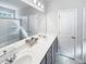 Double vanity bathroom with a large mirror and shower at 220 Machrie Loop # A, Myrtle Beach, SC 29588