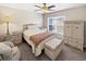 Bedroom with double bed, ceiling fan and wicker furniture at 220 Machrie Loop # A, Myrtle Beach, SC 29588