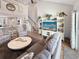 Open living room with high ceilings, a large TV, and access to the kitchen at 220 Machrie Loop # A, Myrtle Beach, SC 29588